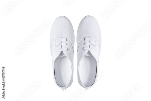Pair of white textile sneakers shoes, isolated