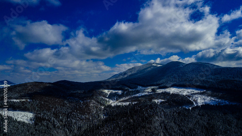 Carpathian mountains mountain range pine forests coniferous mountain tops winter snow aerial photography © Андрей Трубицын