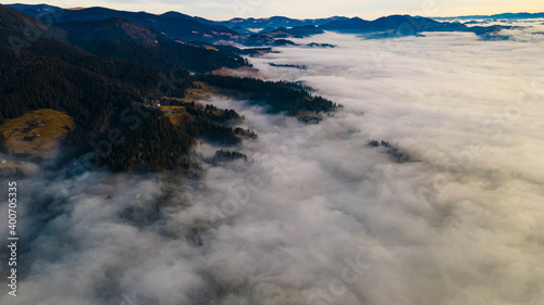 mountains tops high above clouds fog