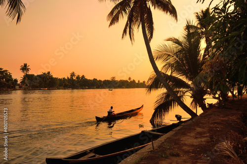 A boat sailing on Kerala backwaters photo