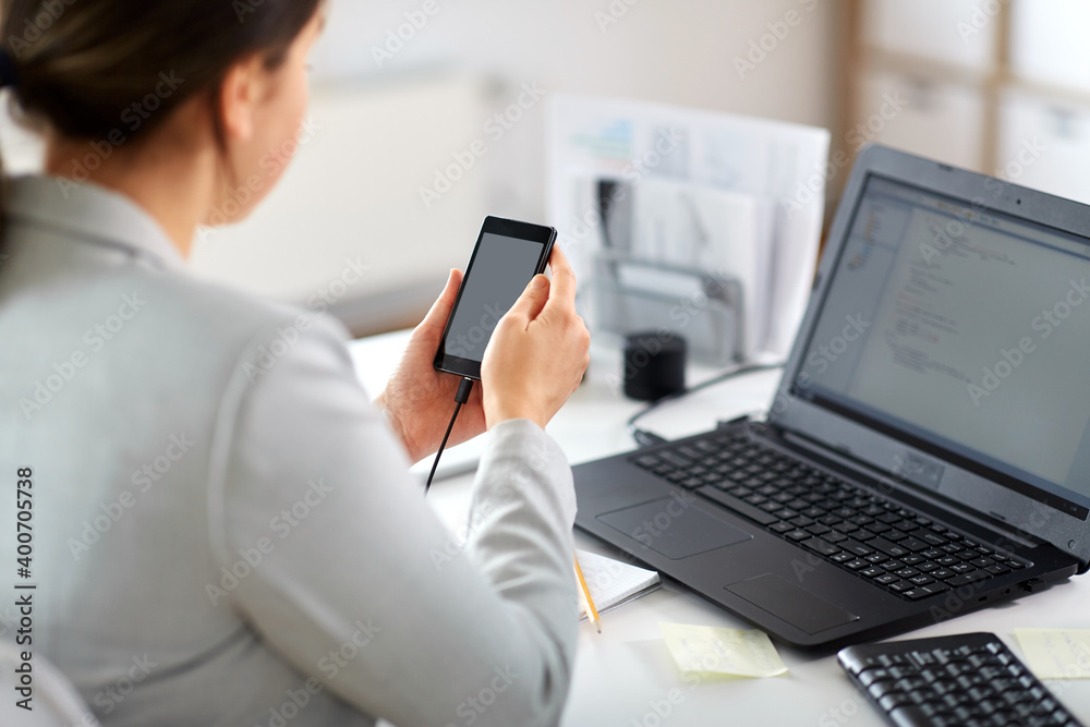 business, corporate, technology and people concept - businesswoman with smartphone working at office business, corporate, technology and people concept - businesswoman with smartphone working at office