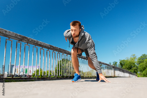 fitness, sport and healthy lifestyle concept - young man running across city bridge © Syda Productions