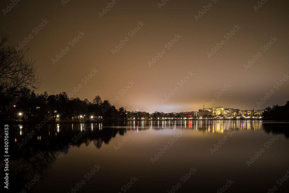 Stockholm, Sweden A night view of the Trekanten Lake in Liljeholmen.