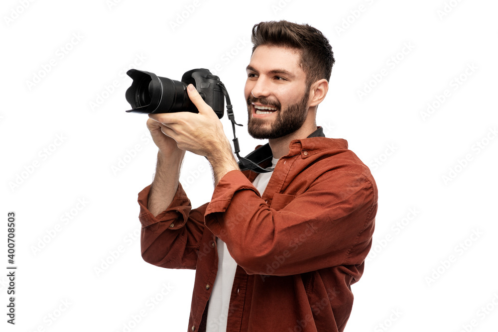 Fototapeta premium photography, profession and people and concept - happy smiling man or photographer with digital camera over white background