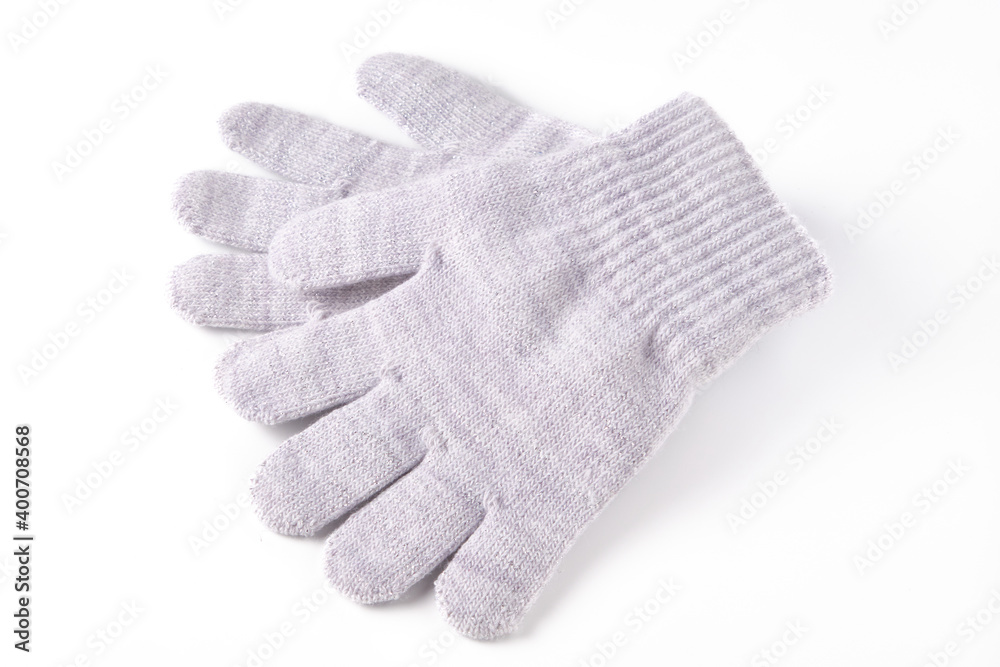 Grey colored winter gloves isolated on white Grey colored winter gloves isolated on white