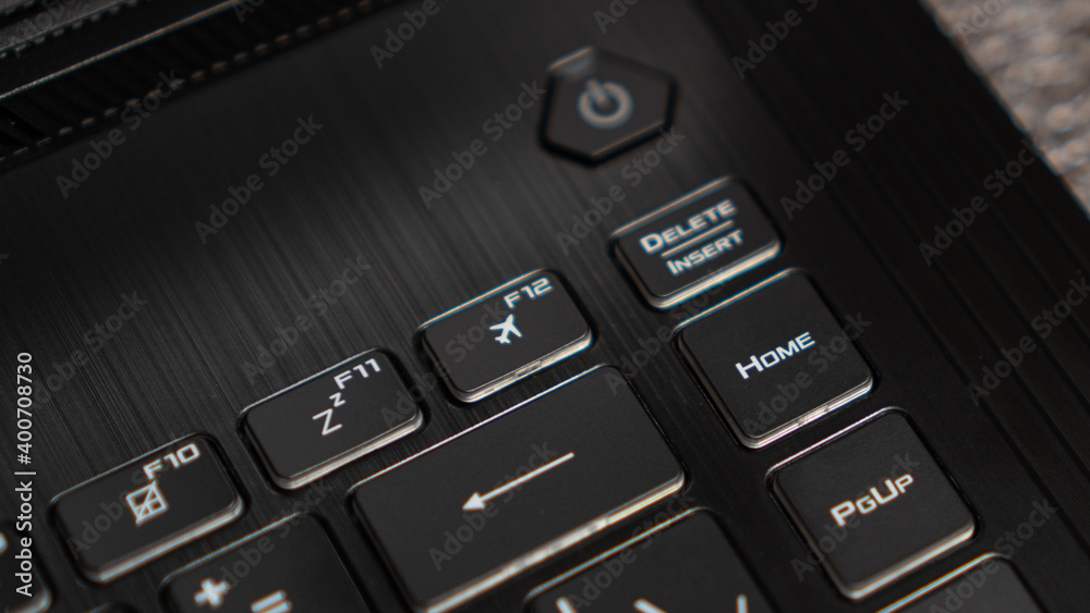 Flight mode button, F12 key, airplane button on keyboard. Laptop flat  profile backlit keyboard airplane flight mode key closeup Stock Photo |  Adobe Stock