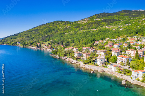 Fototapeta Naklejka Na Ścianę i Meble -  Croatia, beautiful town of Lovran, sea walkway, aerial panoramic view in Kvarner bay coastline, popular tourist destination