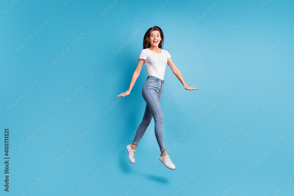 Full size profile side photo of amazed girl jump up air shocked discount isolated on pastel blue color background