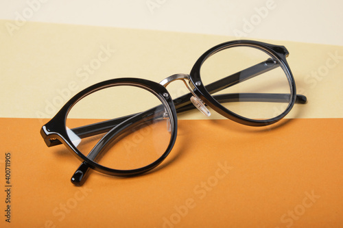 glasses on beige and brown background, geometric background