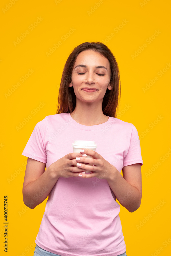 Delighted female enjoying hot drink in morning Delighted female enjoying hot drink in morning
