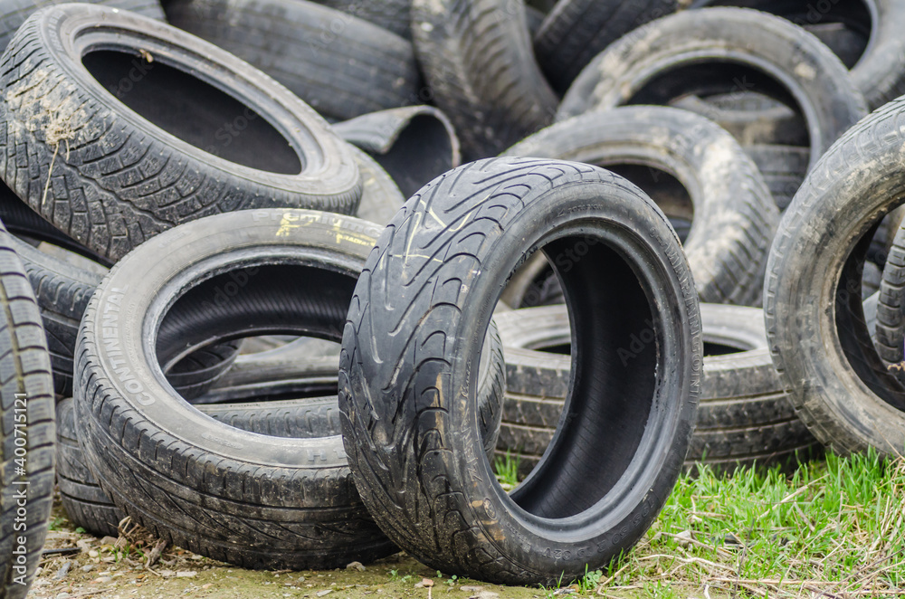 Novi Sad, Serbia - December 21. 2020: A pile of damaged, old, discarded, car tires for recycling