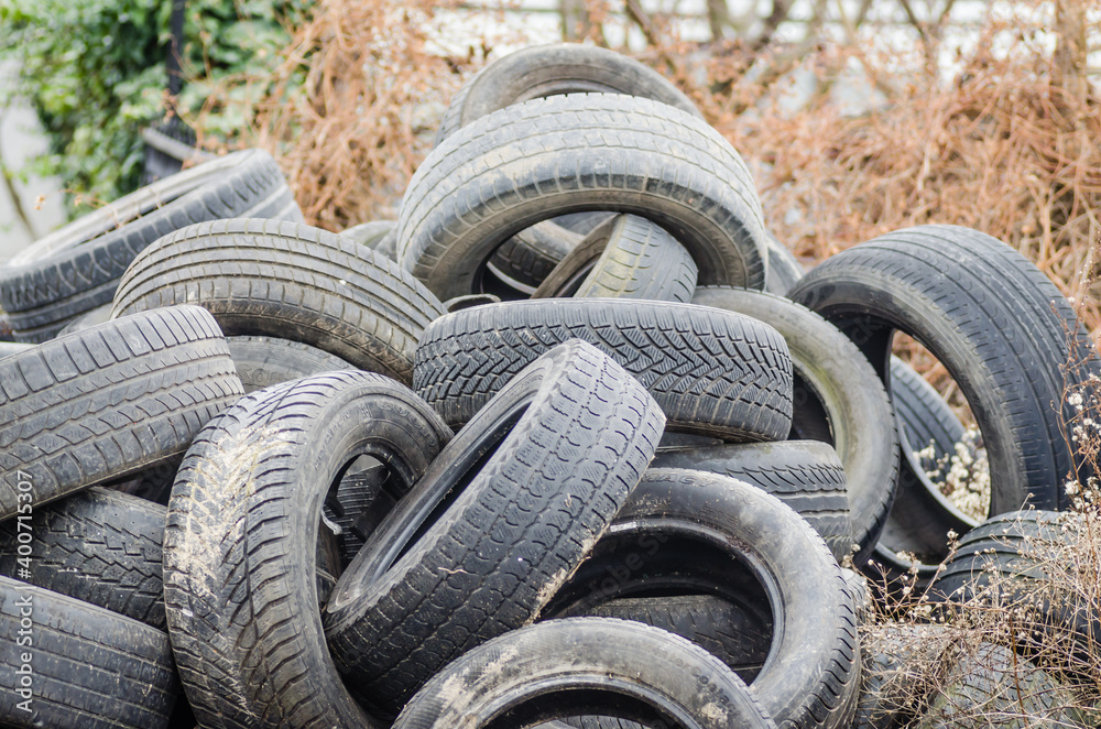 Novi Sad, Serbia - December 21. 2020: A pile of damaged, old, discarded, car tires for recycling