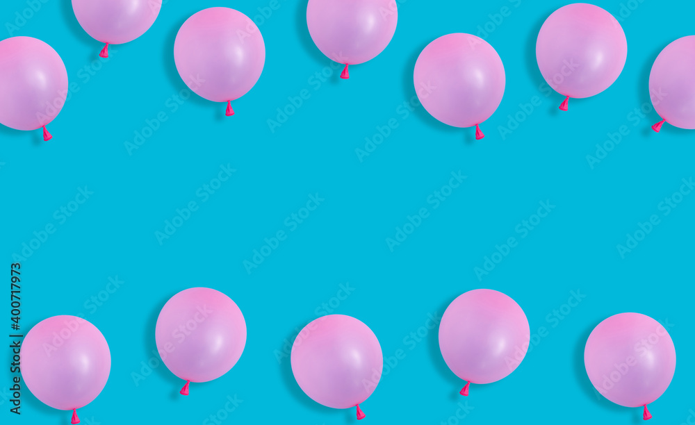 Creative concept with pink balloons on pastel blue background. Flat lay design