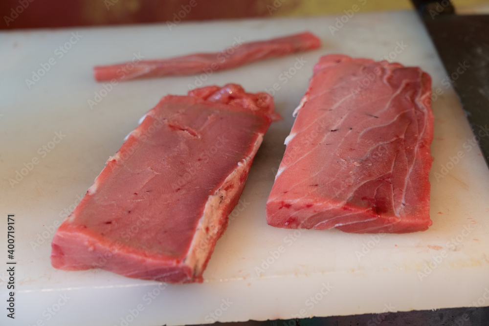 Tuna chunks on a cutting board Tuna chunks on a cutting board