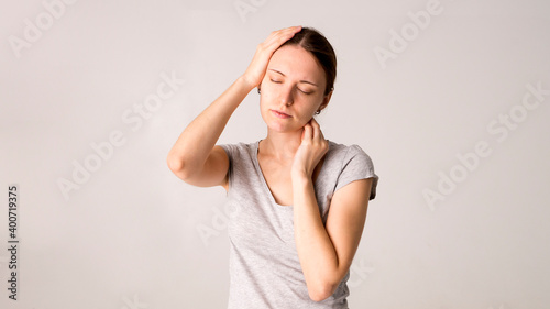 Young beautiful woman having headache