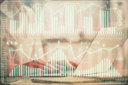 Double exposure of woman hands working on computer and forex graph hologram drawing. Financial analysis concept. © peshkova