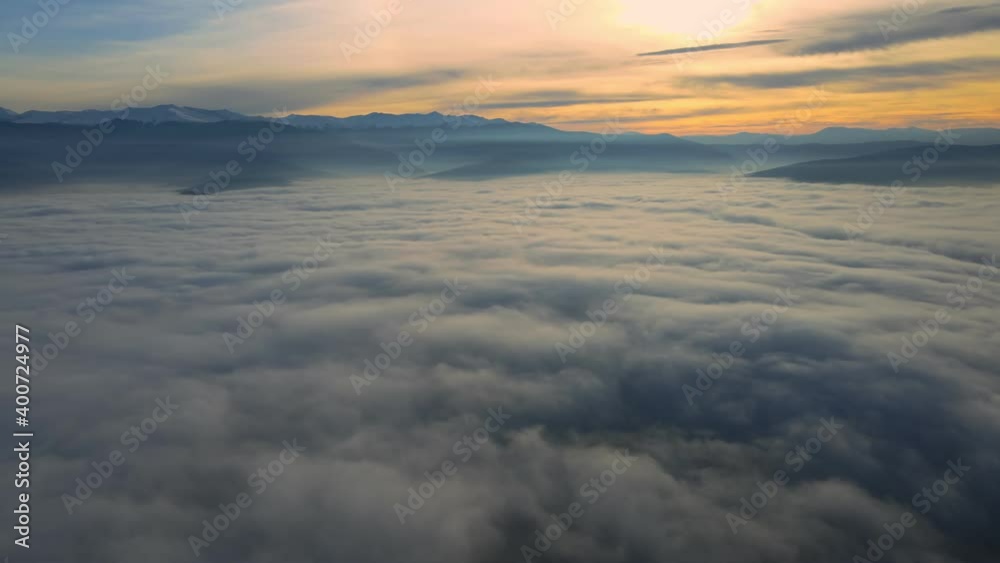 Flying Over The Layer Of Clouds And Looking On Landscape Through The Clouds. Flying Over The Layer Of Clouds And Looking On Landscape Through The Clouds.