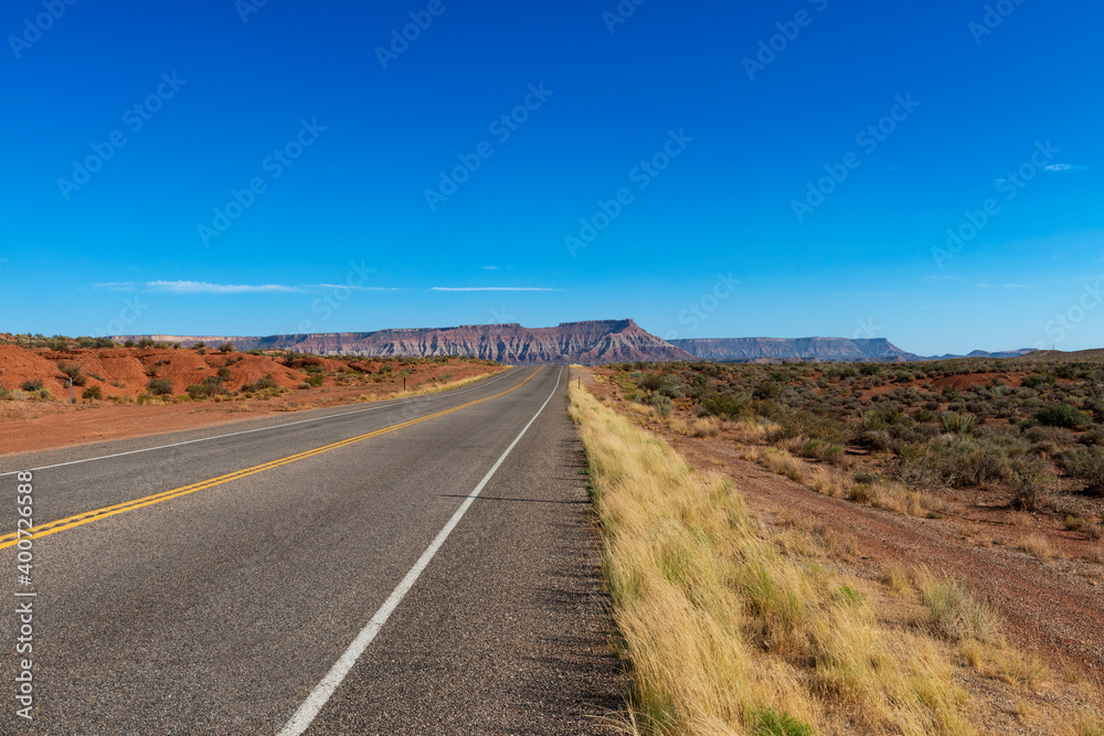 Scenic road near the Zion National Park in the State of Utah, with the beautiful red sandstone mountains.