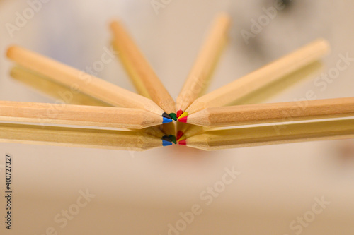 Coloured pencils on mirror table