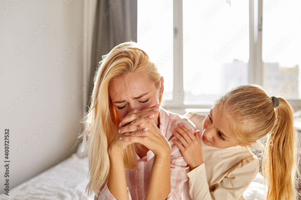 woman in a desperate situation, left without a husband. daughter calm down her, sit supporting woman in a desperate situation, left without a husband. daughter calm down her, sit supporting