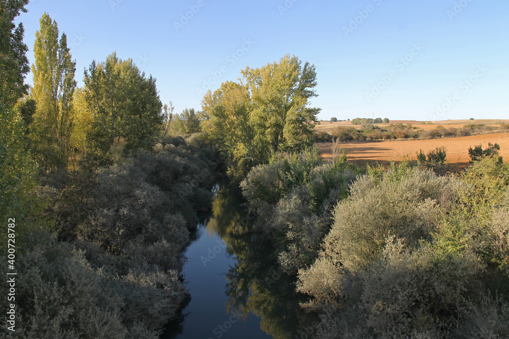 The Valdavia river near the Abanades aqueduct in Castilla, Melgar de Fernamental, Burgos, Spain The Valdavia river near the Abanades aqueduct in Castilla, Melgar de Fernamental, Burgos, Spain