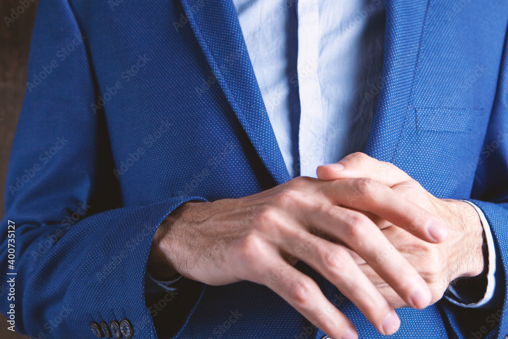 Man massaging his sore finger, Man massaging his sore finger,
