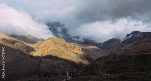 Mystical mountain peaks in the fog, haze