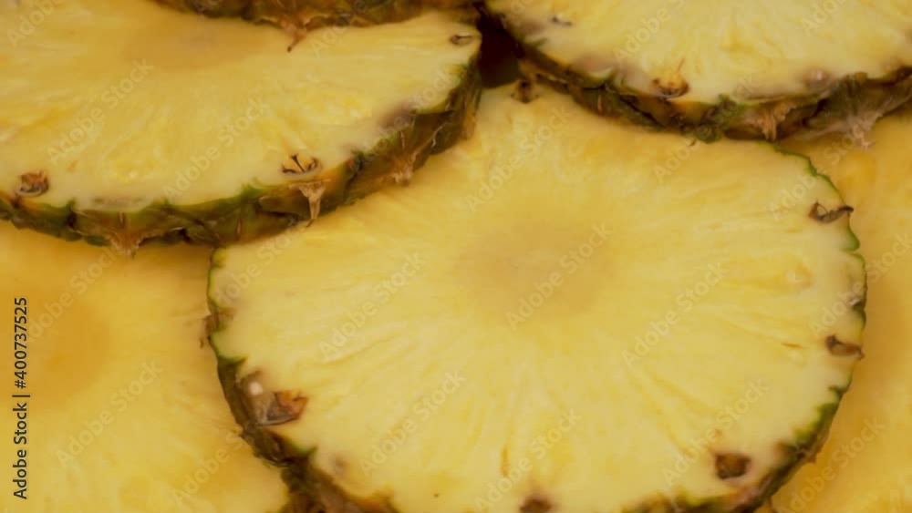 Ripe Delicious Tropical Fruit Pineapple Slices Rotate, Macro. The Concept Of Healthy Vegetarian Food. Ripe Delicious Tropical Fruit Pineapple Slices Rotate, Macro. The Concept Of Healthy Vegetarian Food.