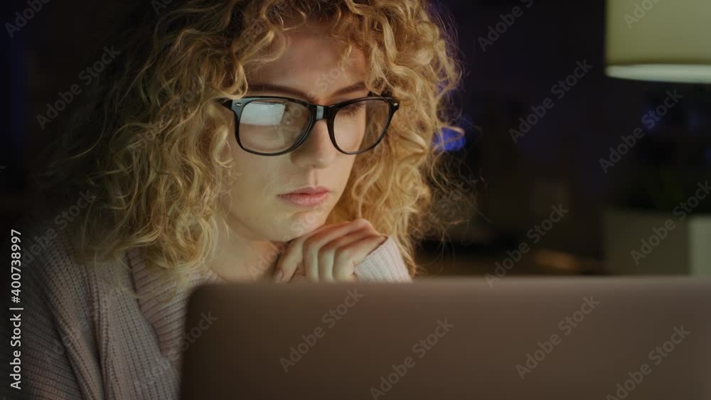 Close up video of woman in front of a laptop. Shot with RED helium camera in 8K. Close up video of woman in front of a laptop. Shot with RED helium camera in 8K.
