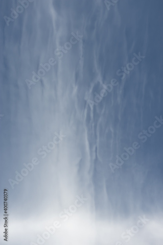 Natural art created by clouds like cotton wool against a blue sky.