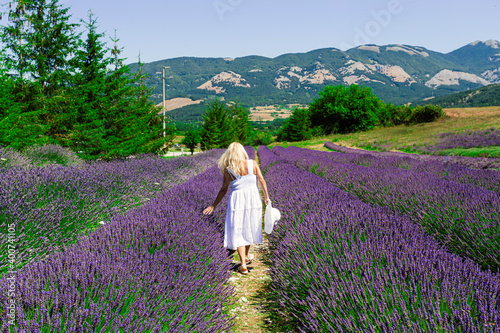 Woman from behind in a field of lavender