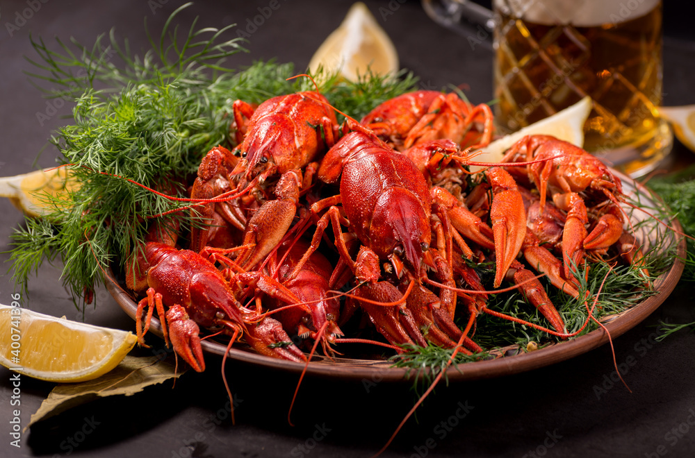 Crayfish boiled on a dish with dill spices and lemon. Crayfish boiled on a dish with dill spices and lemon.