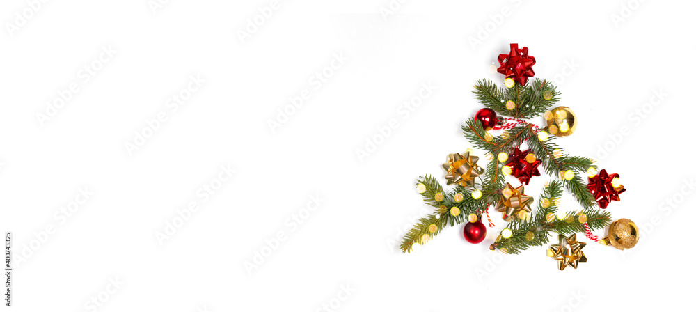 Minimal creative winter layout with evergreen tree branches, decor bows, light blair with copy space on white background