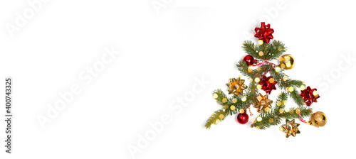 Minimal creative winter layout with evergreen tree branches, decor bows, light blair with copy space on white background