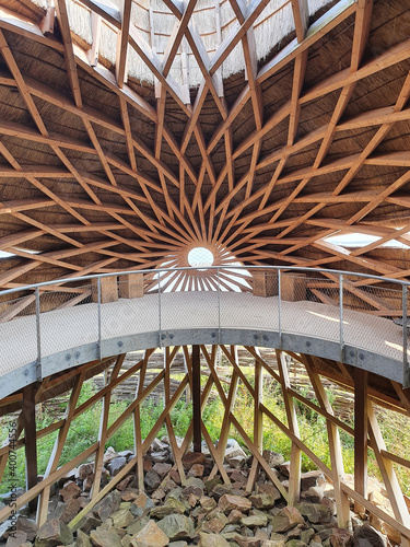 Stellendam, The Netherlands, September 11, 2020: the spectacular interior space of Tij bird-watching observatory with its wooden construction and thatched cladding photo