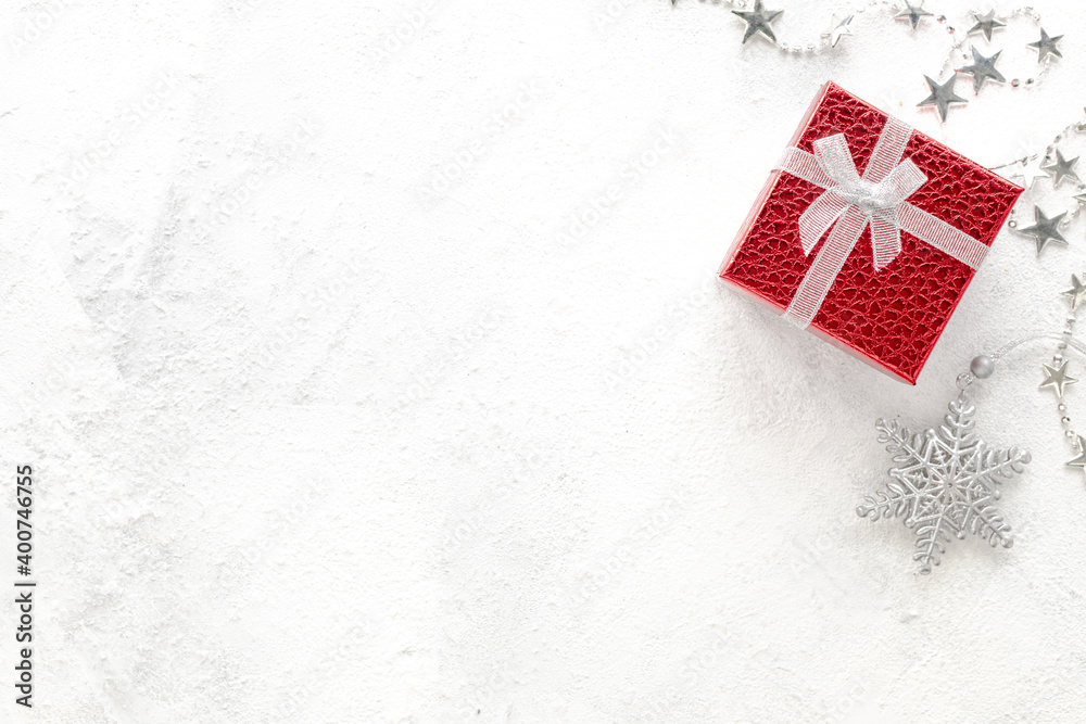 Flat lay of Celebration. New Year's composition. Christmas red and silver decorations on a white background. Flat lay of Celebration. New Year's composition. Christmas red and silver decorations on a white background.