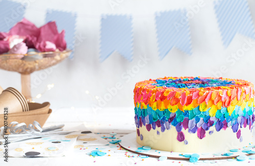 Colorful big handmade birthday cake on the holiday table