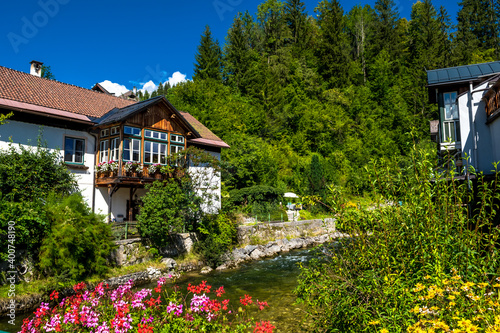 Picturesque Houses Beneath Mountain River In Bad Aussee In Austria photo