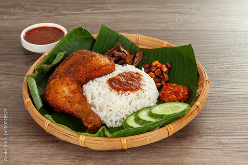 Nasi Kukus is a traditional delicacy originally from the East Coast of Peninsular Malaysia. Deliciously spicy, its popularity as the perfect meal-on-the-go means almost every state in the country has  photo