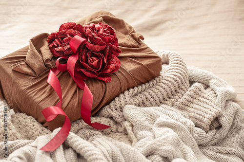 Beautifully wrapped and decorated with roses valentine's day gift close up. © puhimec