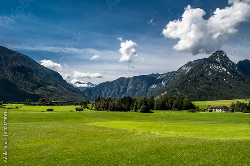 Rural Landscape With Houses In Front Of Mountain Dachstein In The Alps Of Austria