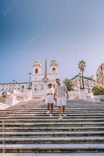 Photography young couple mid age on a city trip in Rome Italy Europe, couple visit Spanish s
