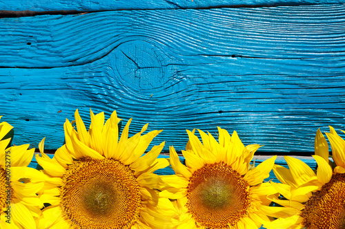 sunflowers on an old wooden background with copy space