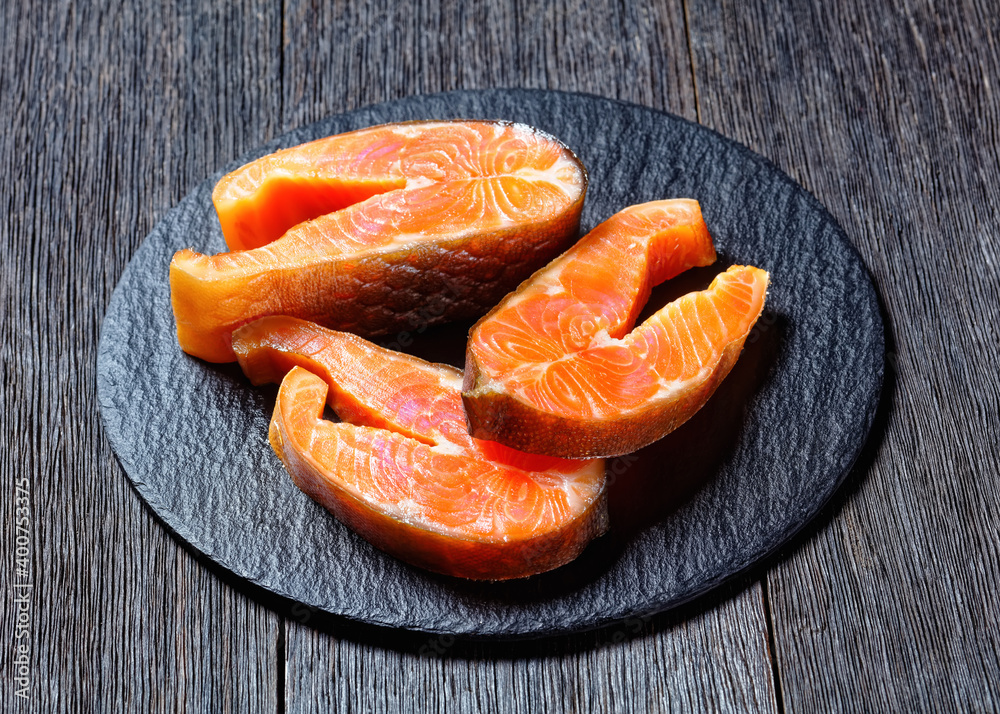 Cold-smoked arctic char on a wooden background Cold-smoked arctic char on a wooden background