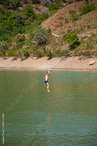 Bungee jump on Panagia lake in Crimea on a summer day