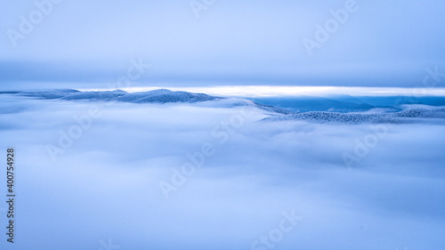 Fototapeta Naklejka Na Ścianę i Meble -  Mountain peaks over the clouds. An unigue vista. Bieszczady National Park. Carpathians. Poland.