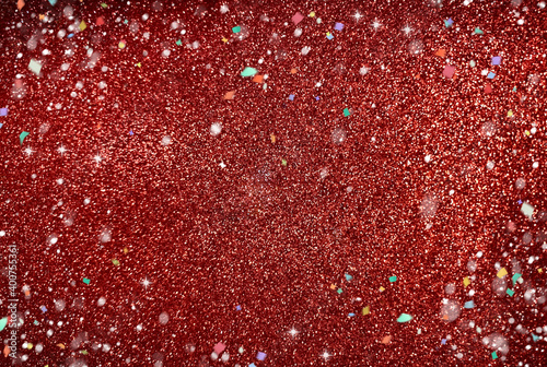 Red shiny texture.  Glitter for a festive background.  Blurred background out of focus.  New year, new year background.