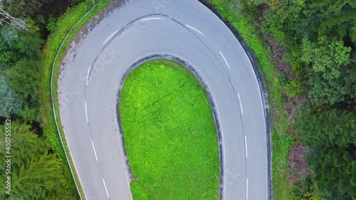 Aerial Top Down View Of Scenic Empty Windy Road In Forest Landscape. Pedestal Down photo