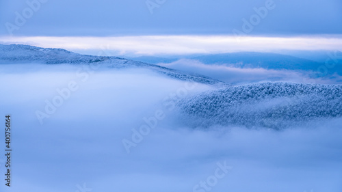 Fototapeta Naklejka Na Ścianę i Meble -  Mountain peaks over the clouds. An unigue vista. Bieszczady National Park. Carpathians. Poland.