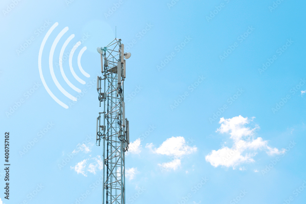 a tower with antennas that broadcasts a signal against a blue sky with clouds a tower with antennas that broadcasts a signal against a blue sky with clouds